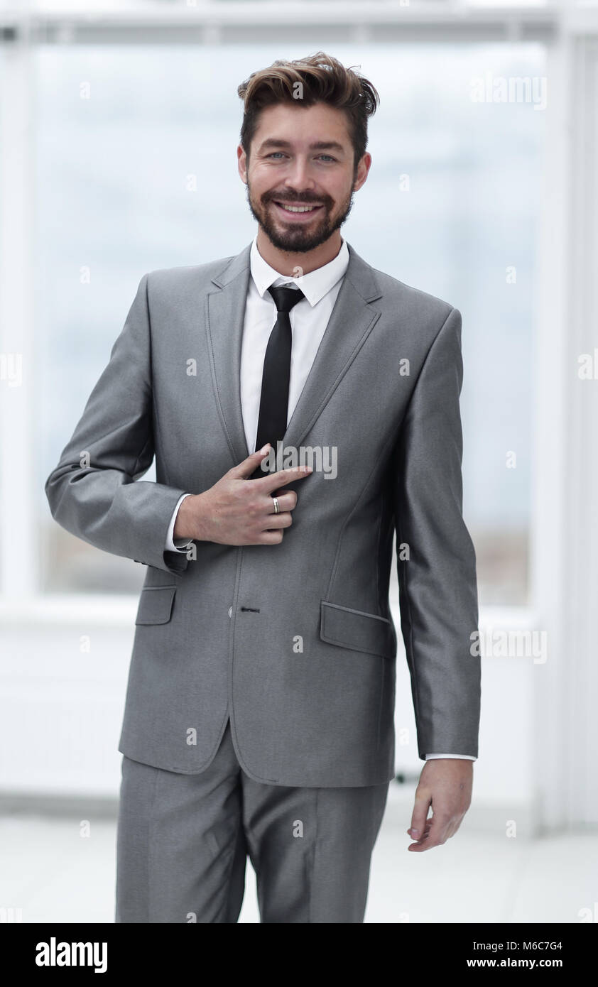 A young man in a gray suit Stock Photo - Alamy