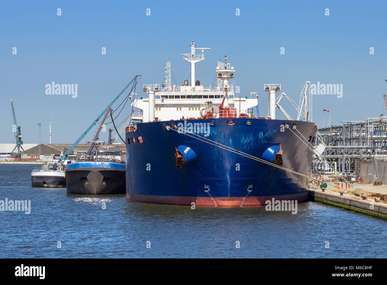 Oil tanker moored at an oil terminal in the Port of Antwerp. Stock Photo