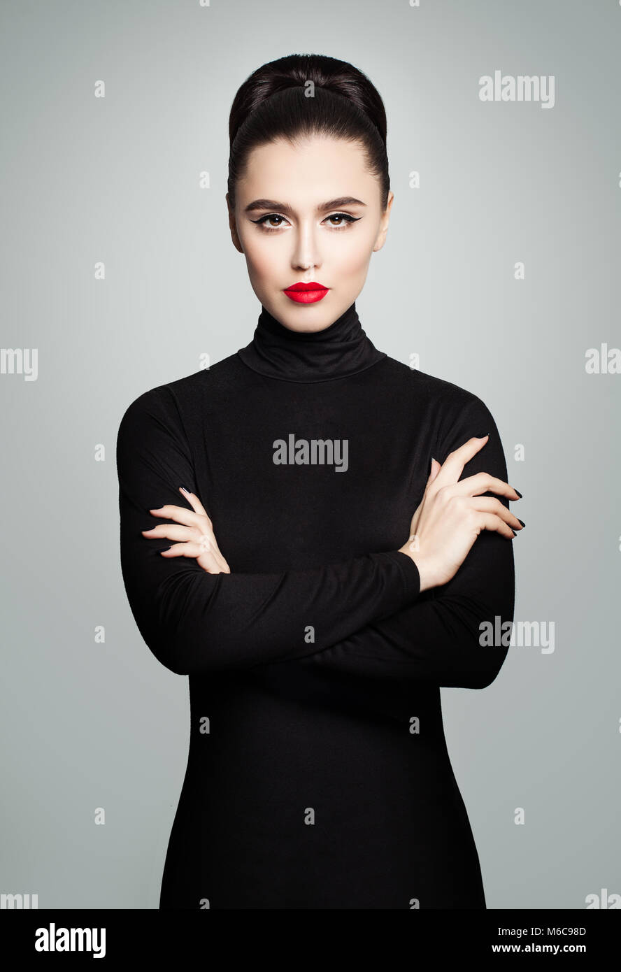 Perfect Young Model Woman wearing Black Roll Neck Dress, Fashion Studio Female Portrait Stock Photo
