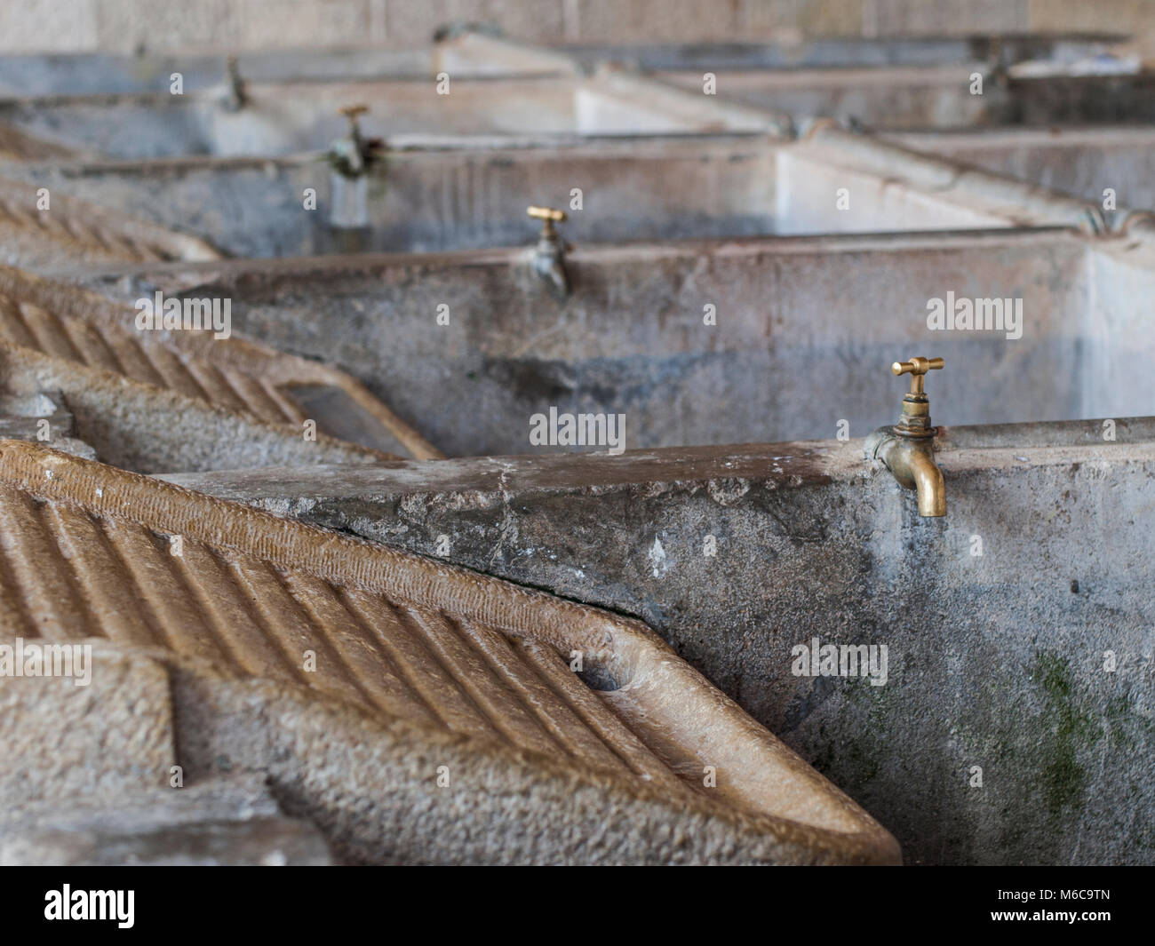 Communal laundry washing area in Vila do Bispo in Portugal. Rubbing stones and slop stones. Stock Photo