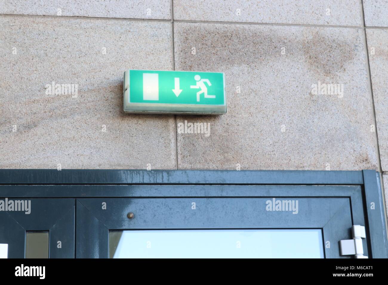 Green Emergency Fire Exit Sign Stock Photo