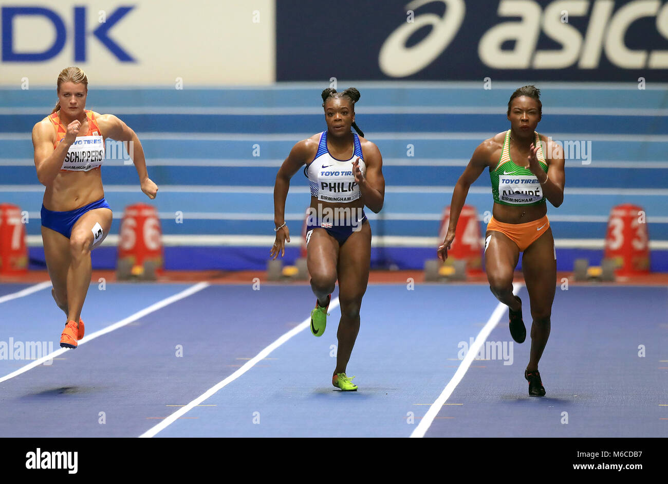 Ivory Coast's Murielle Ahoure (right) wins the Women's 60m to set a new world leading record ahead of Netherlands' Dafne Schippers (left) in third and Great Britain's Asha Philip in fifth during day two of the 2018 IAAF Indoor World Championships at The Arena Birmingham. Stock Photo