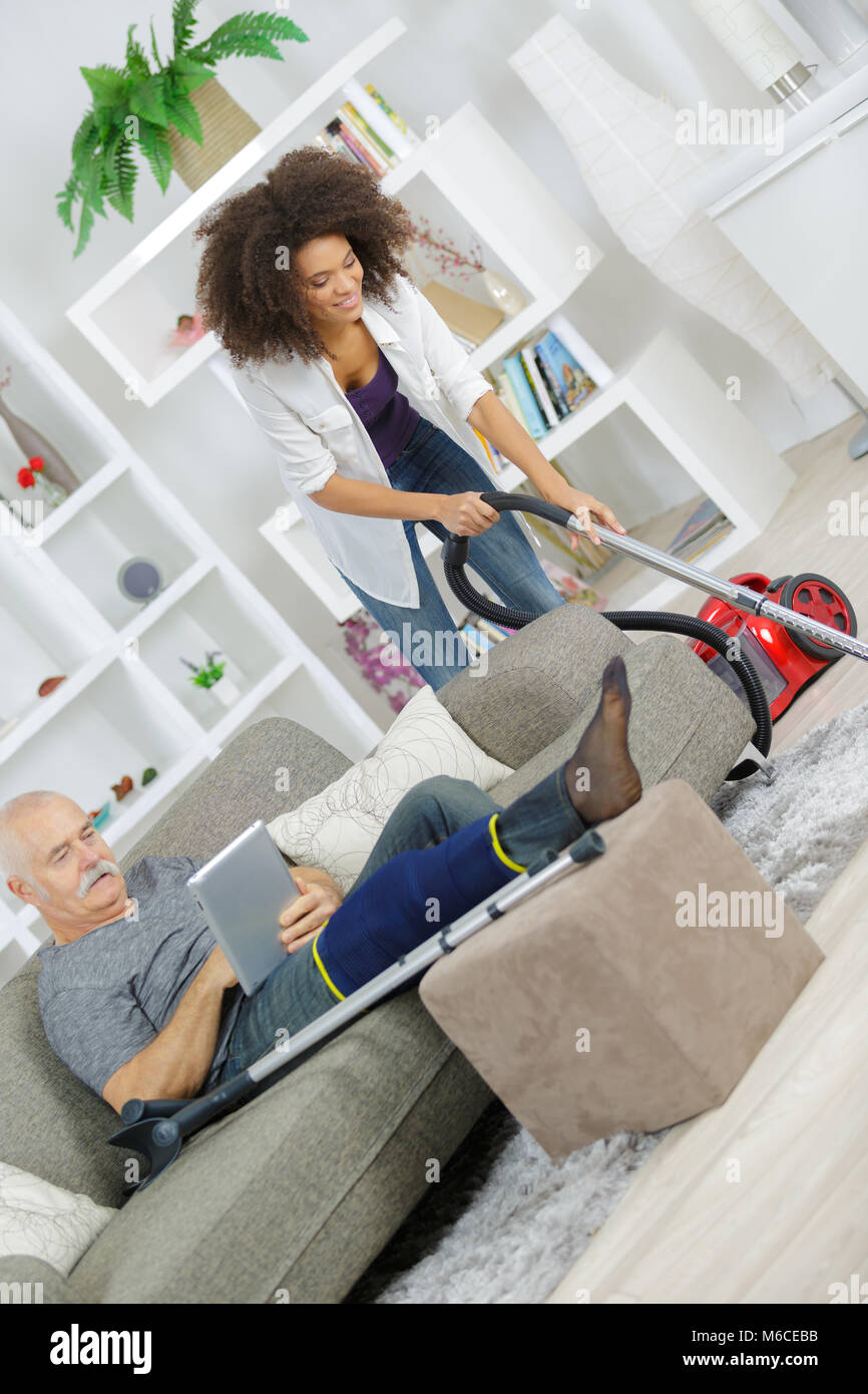 woman with vacuum cleaner cleaning carpet at home Stock Photo - Alamy
