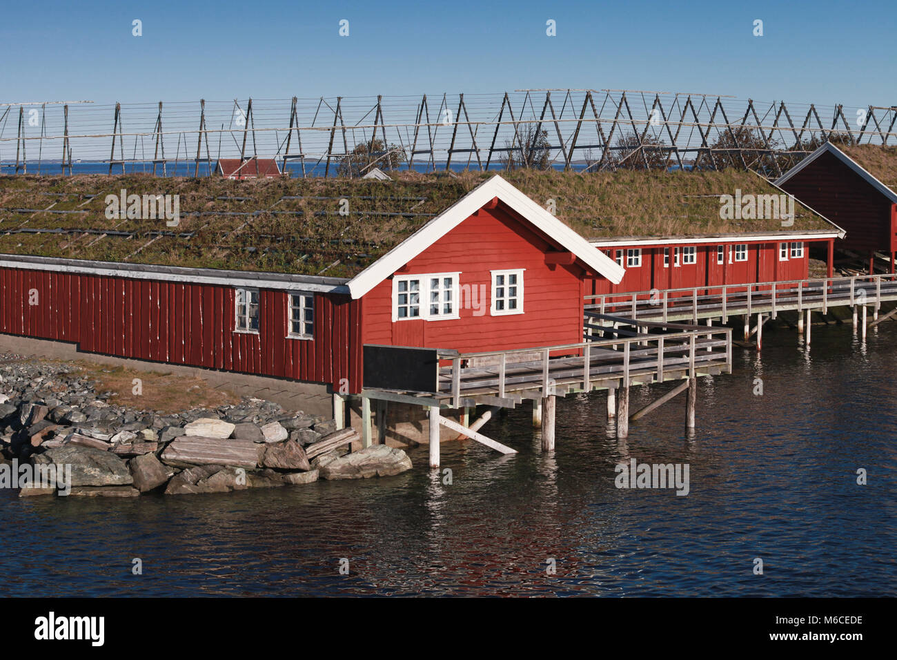 Rural Norwegian landscape, traditional red wooden houses on rocky ...