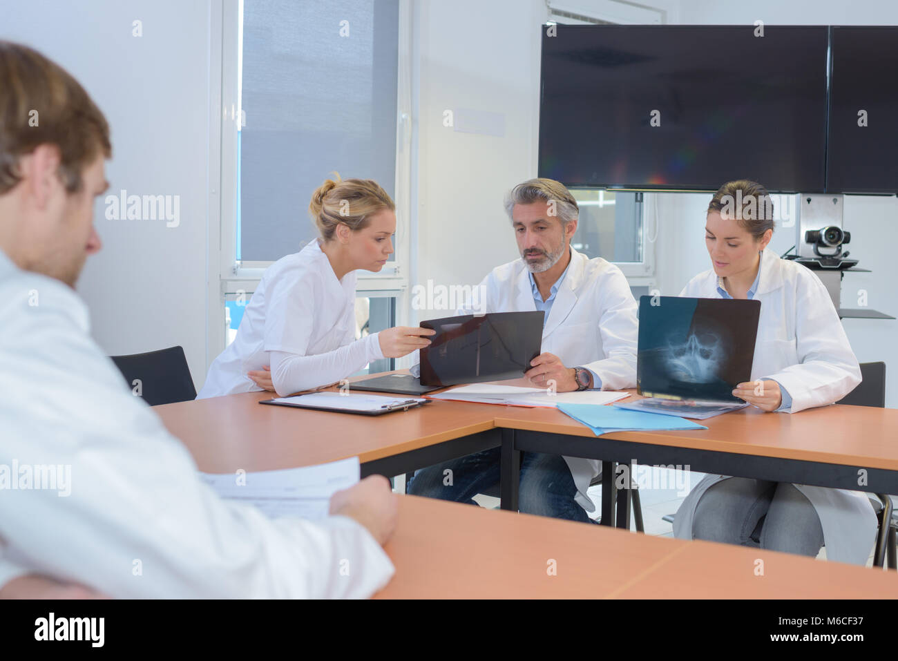 Medical workers sharing notes and scans stock photo alamy