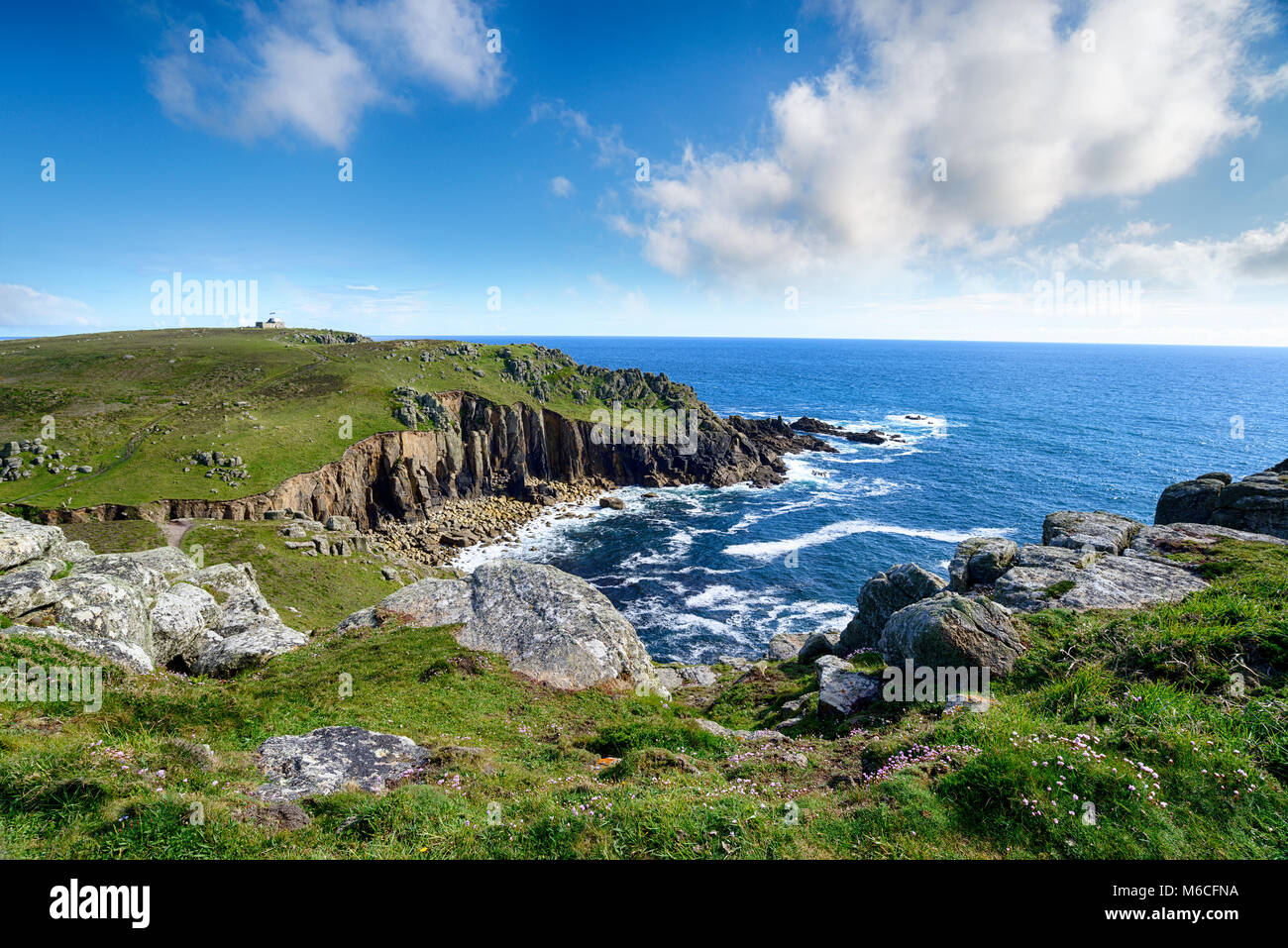Porth Loe cove on the Cornwall coast looking out at Gwennap Head near Porthgwarra Stock Photo