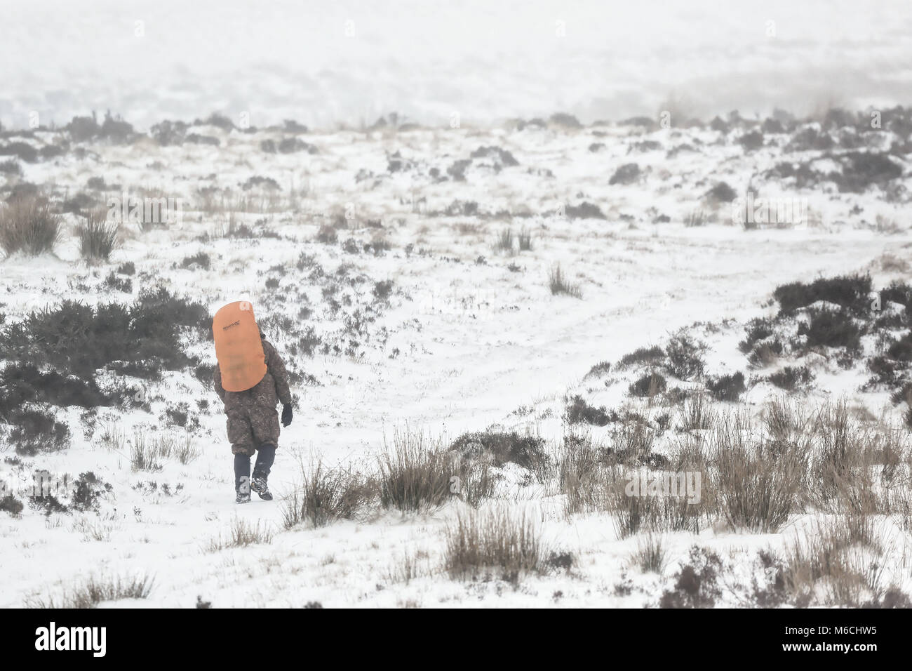 WEATHER PICTURE WALES Pictured: A man climbs the path to the summit of Penyfan in Storey Arms, Brecon Beacons in south Wales, UK. Friday 02 March 2018 Stock Photo
