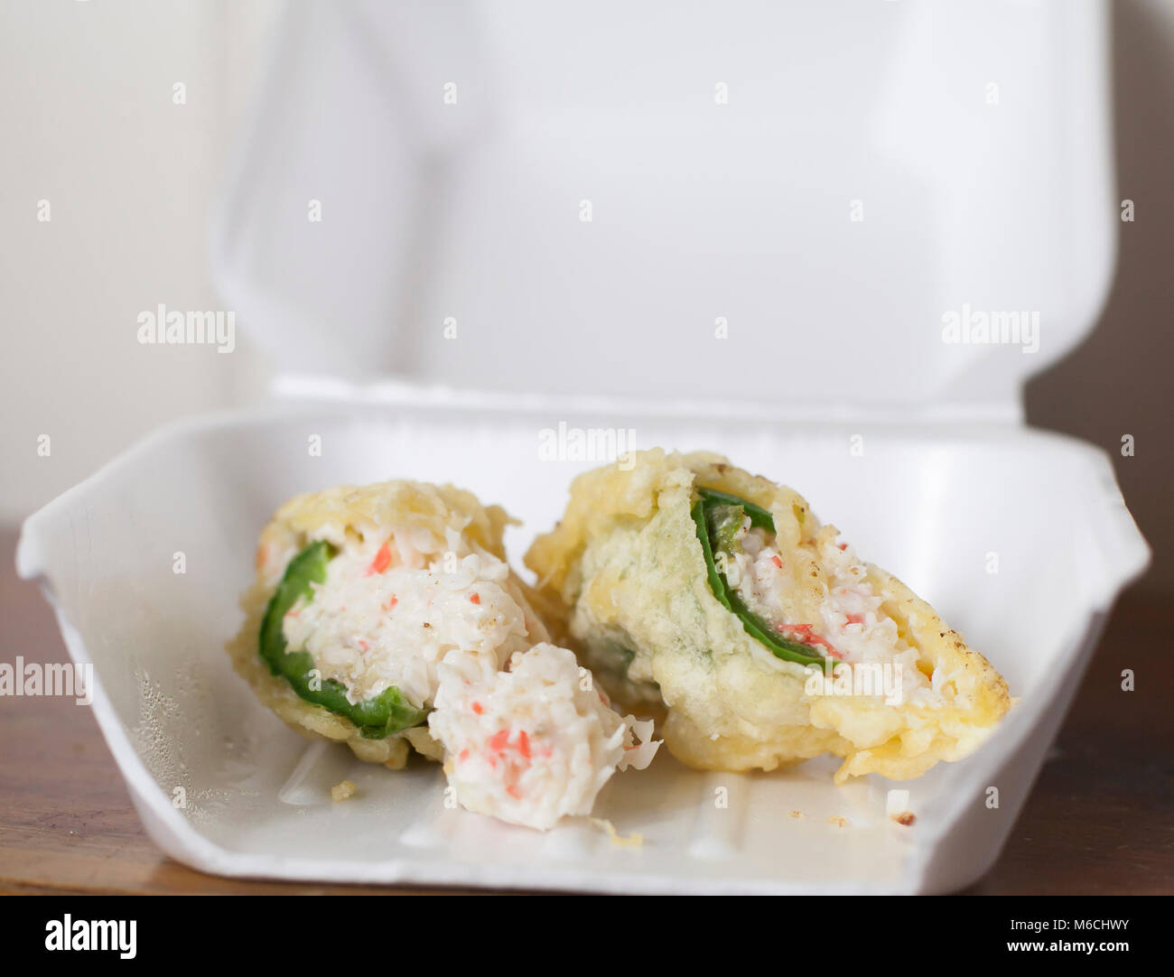 Deep fried crab stuffed jalapeños in a carry out box Stock Photo Alamy