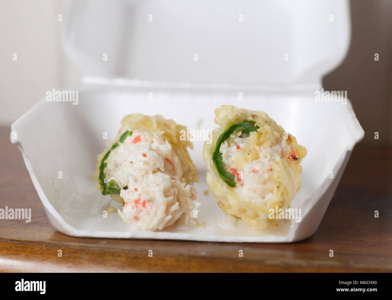 Deep fried crab stuffed jalapeños in a carry out box Stock Photo Alamy