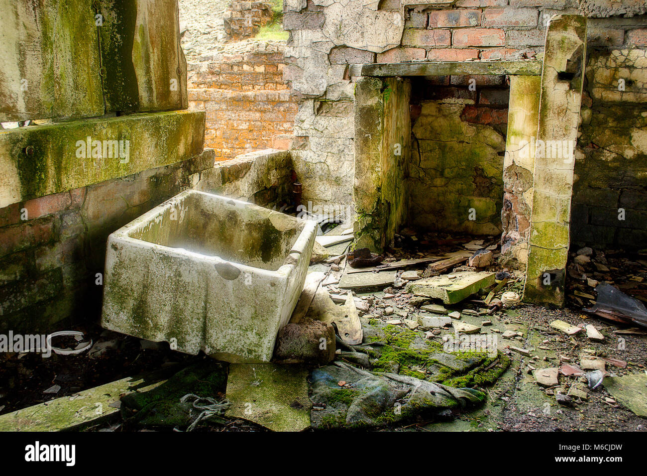 Derelict building filled with broken rubbish Stock Photo