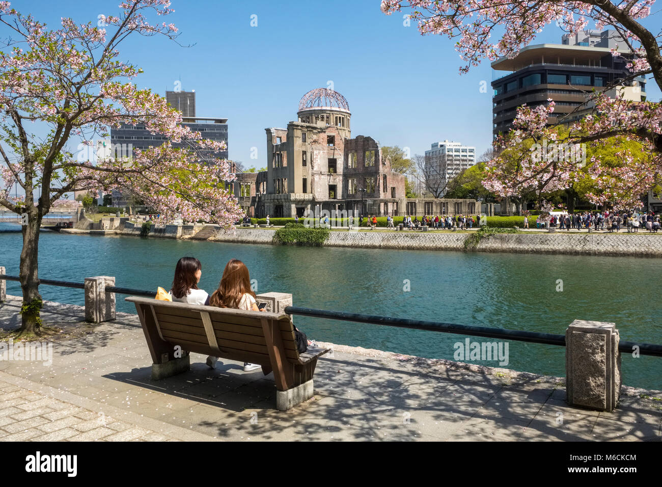 Ota River, with Hiroshima Atomic Bomb Dome, Peace Memorial Park, Hiroshima, Japan and tourists Stock Photo