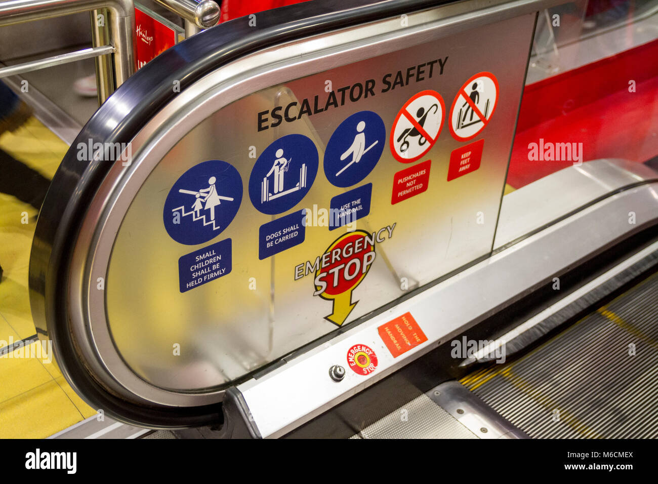 Security, Safety signs on an escalator in a shop, London UK Stock Photo