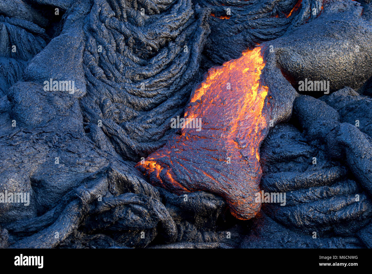 Fresh lava flows creating new rock,  Hawaii Volcanoes National Park, Hawai'i Island, Hawaii Stock Photo