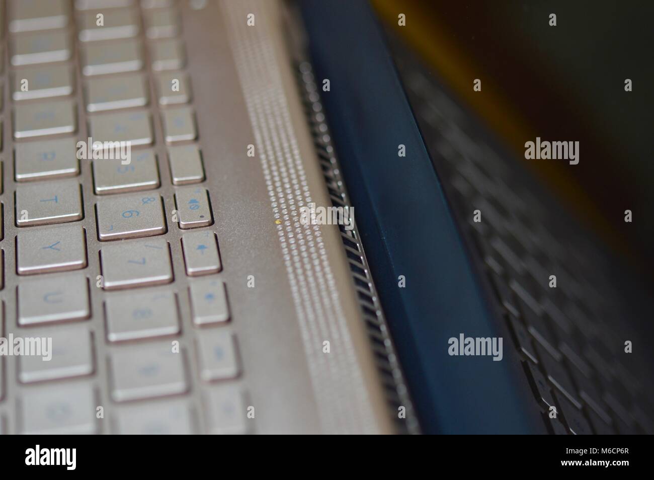 Keyboard of a bronze colored laptop Stock Photo Alamy
