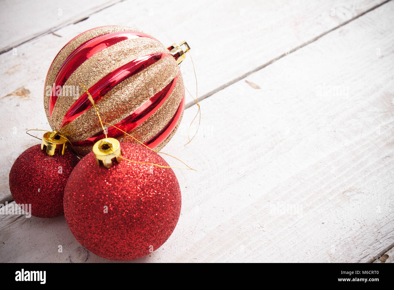 Christmas background. Pink Christmas ornaments on a white wooden background. Stock Photo