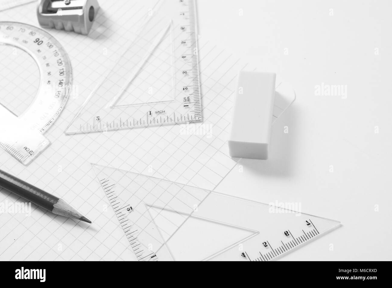 Protractor, rulers, pencil and eraser on squared paper Stock Photo Alamy