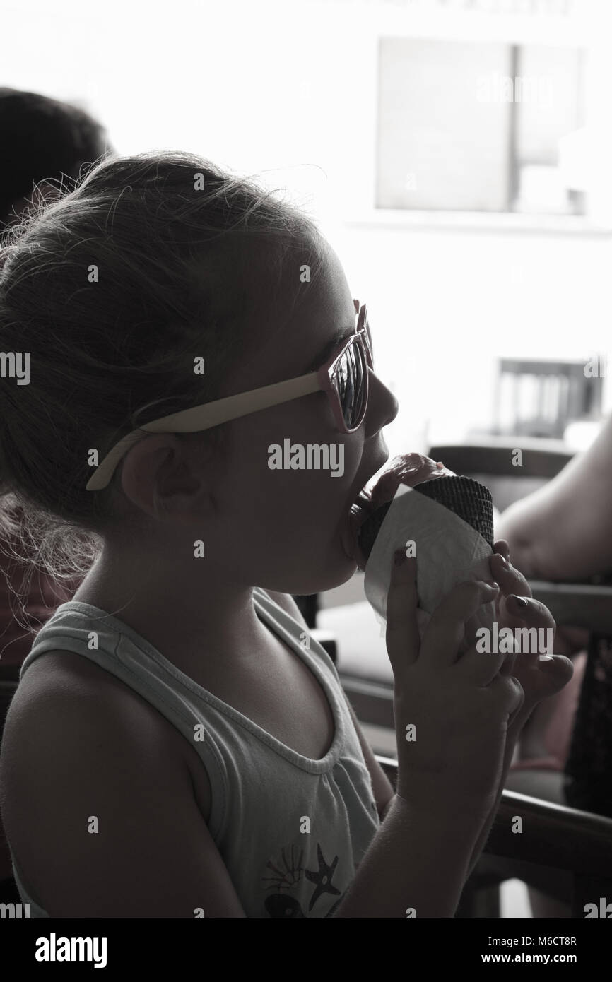 Girl licking ice cream cone,black and white image Stock Photo - Alamy