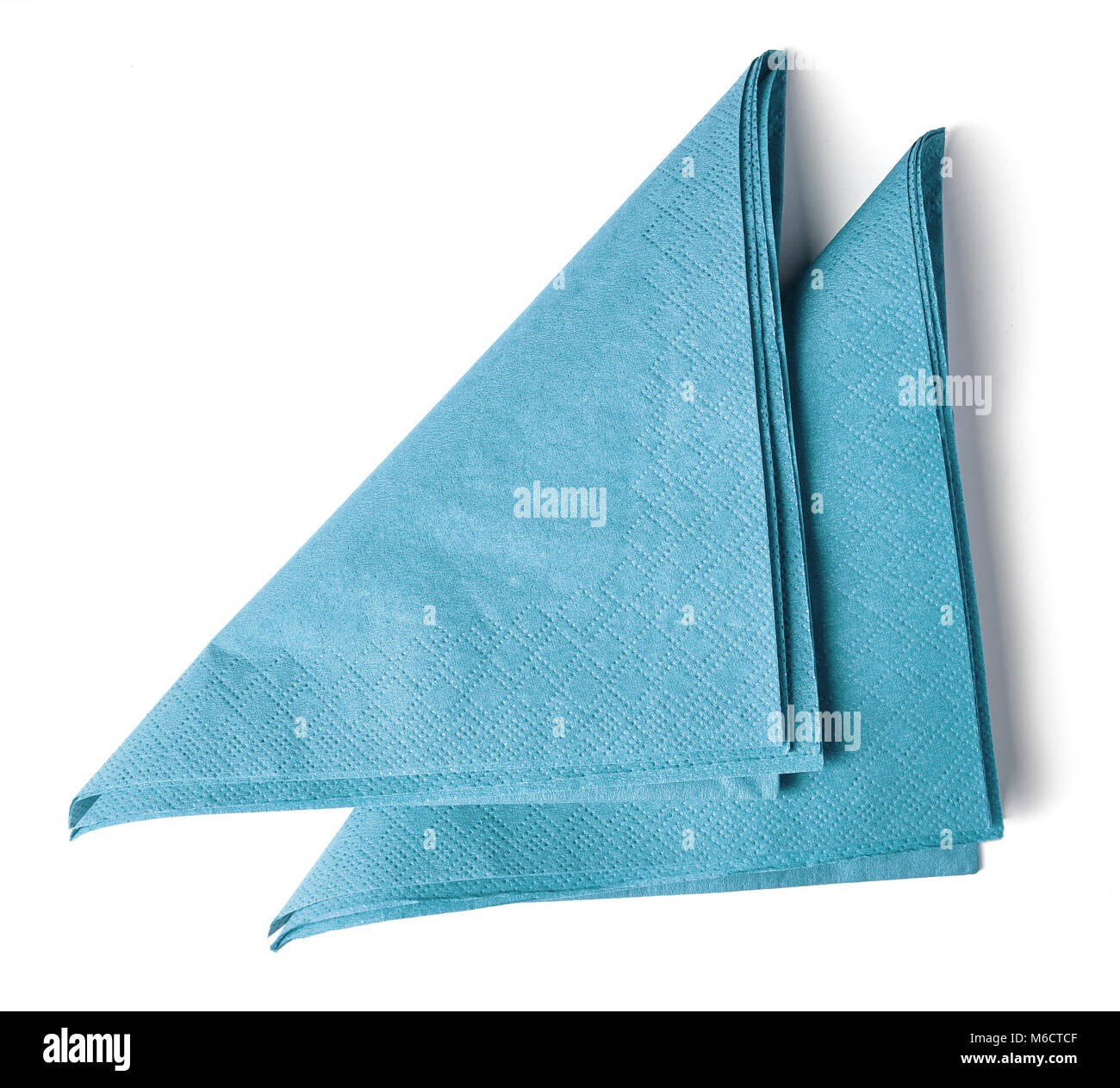 Light blue paper napkins isolated on white background; top view Stock