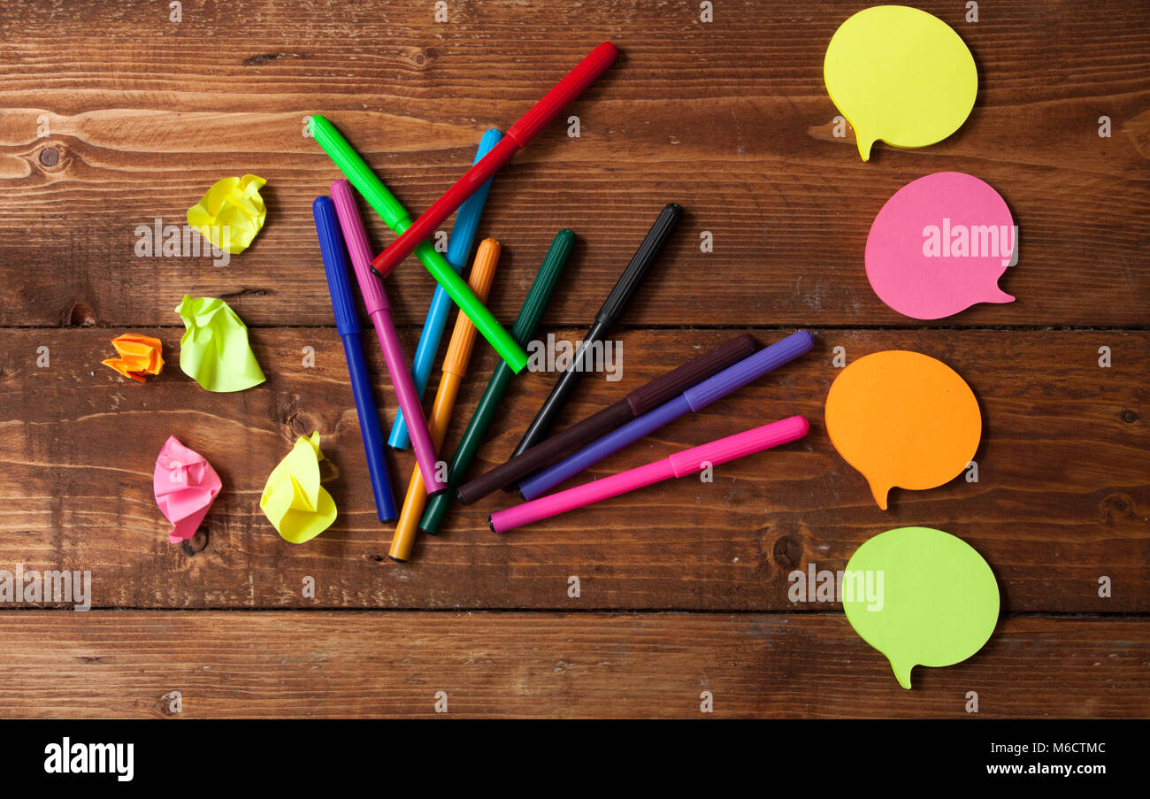 Bright stationery objects on wooden table close up. Stock Photo