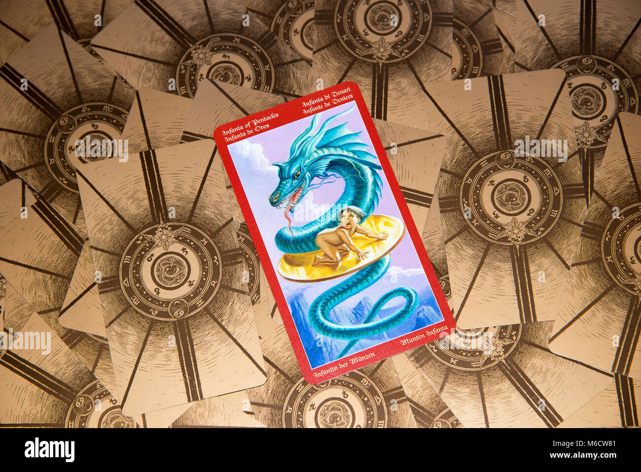 Moscow, Russia - February 18, 2018: Tarot card Page of Pentacles. Dragon tarot deck. Esoteric mysterious background in gothic style Stock Photo
