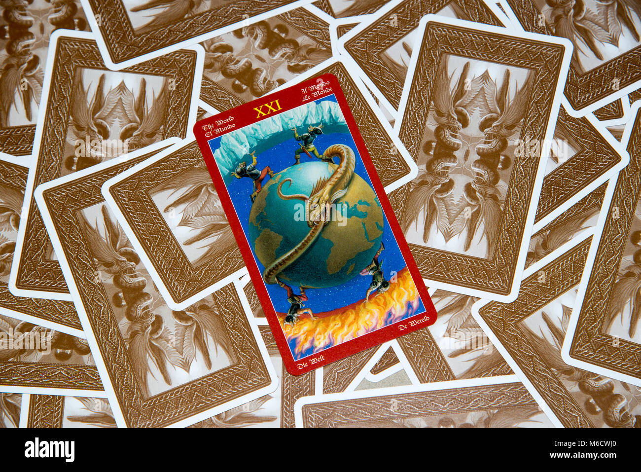 Moscow, Russia - February 18, 2018: Tarot card The World. Dragon tarot deck. Esoteric mysterious background in gothic style Stock Photo