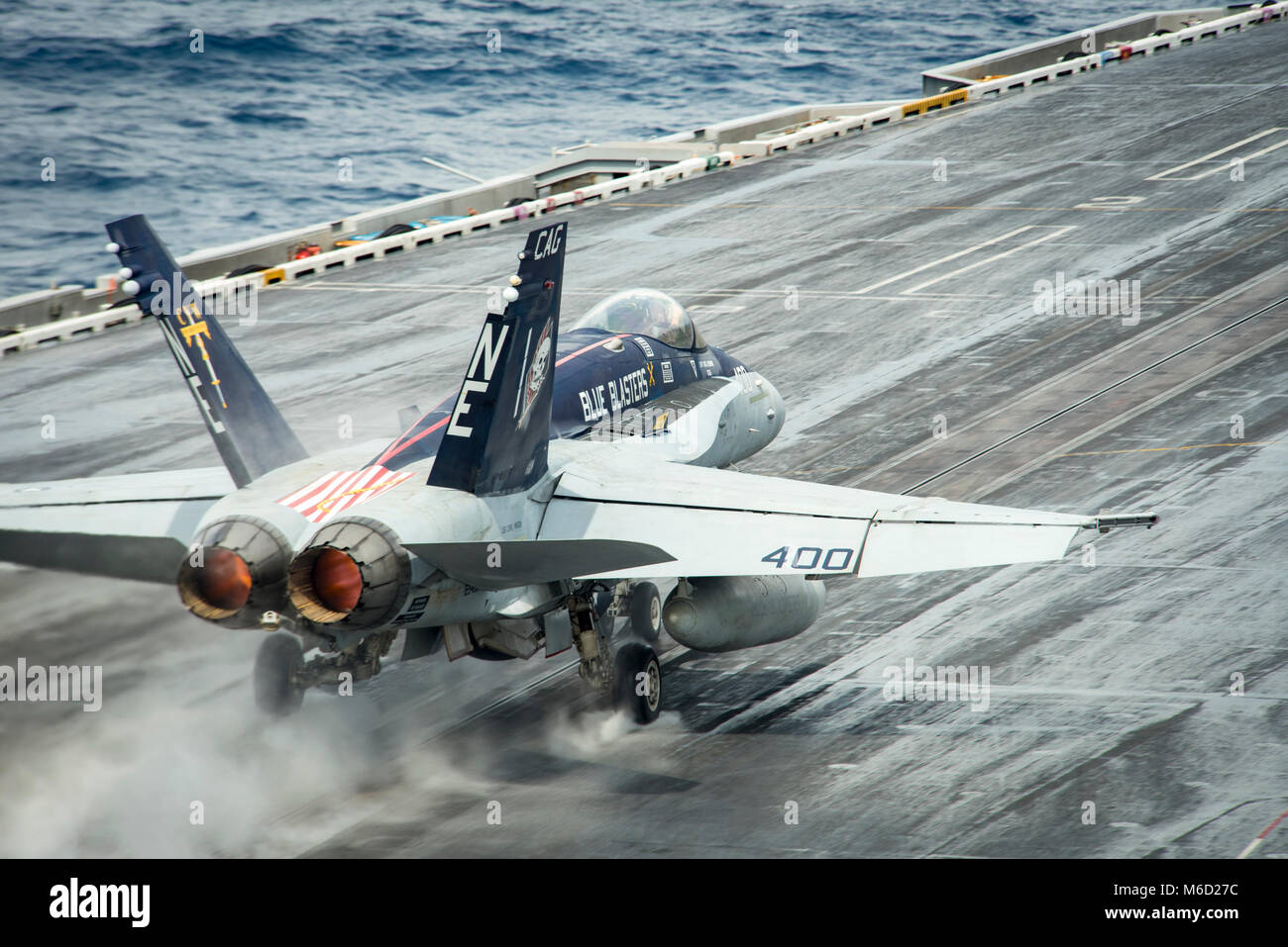 180227-N-WE240-0119  SOUTH CHINA SEA (Feb. 27, 2018) An F/A-18C Super Hornet assigned to the “Kestrels” of Strike Fighter Squadron (VFA) 137 takes off from the Nimitz-class aircraft carrier USS Carl Vinson (CVN 70). The Carl Vinson Strike Group is operating in the western Pacific during a regularly scheduled deployment. (U.S. Navy photo by Mass Communication Specialist 3rd Class Elton Charles Wheeler/Released) Stock Photo