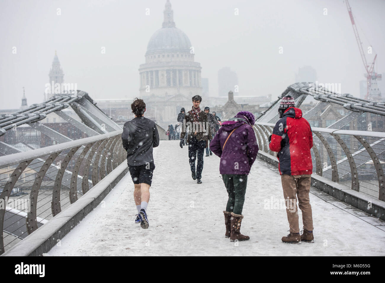 London, UK. 2nd Mar, 2018. People seen at the Millenium Bridge under snowy weather. Credit: B Rouco-3090.jpg/SOPA Images/ZUMA Wire/Alamy Live News Stock Photo