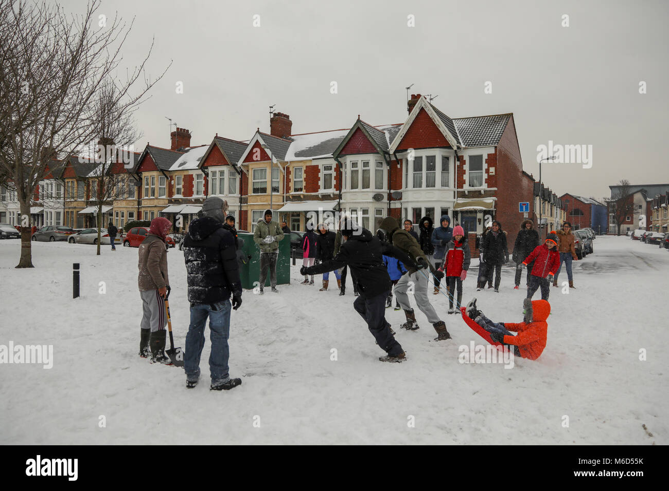 Cardiff, Wales, UK. 2nd Mar, 2018. Cardiff residents enjoy the snow outside the Shri Swaminarayan Mandir, Hindu temple in Grangetown, Cardiff, Following a night of heavy snow and blizzard conditions. Cardiff has been given a red weather alert due to Storm Emma, known also as the Beast from the East. Further snow and bad weather is forecasted throughout the night. Credit: Haydn Denman/Alamy Live News Stock Photo