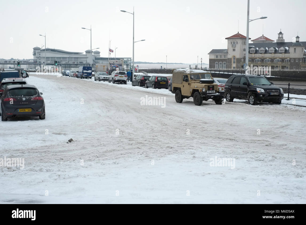 Weston super mare. UK. 2nd March, 2018.A  four wheel drive vehicle braves the roads along the sea front after heavy snow Credit:  Alamy Live News Stock Photo