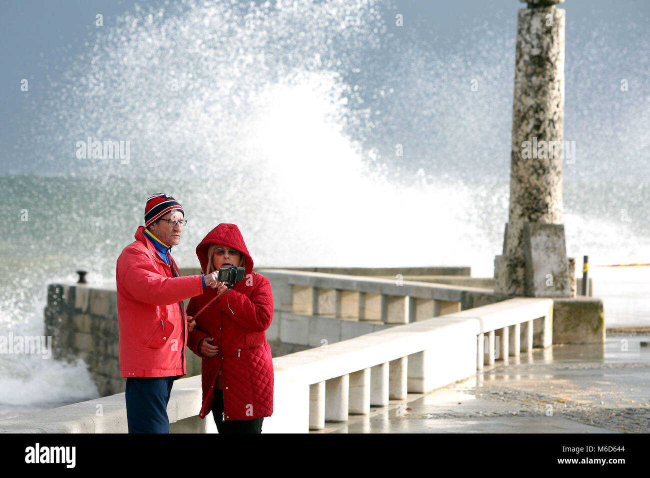 Lisbon, Portugal. 2nd Mar, 2018. A couple make a selfie during the strong swell that is felt at Paco de Arcos, outskirts of Lisbon and in all the Portuguese coast, on March 2, 2018. Credit: Pedro Fiuza/ZUMA Wire/Alamy Live News Stock Photo