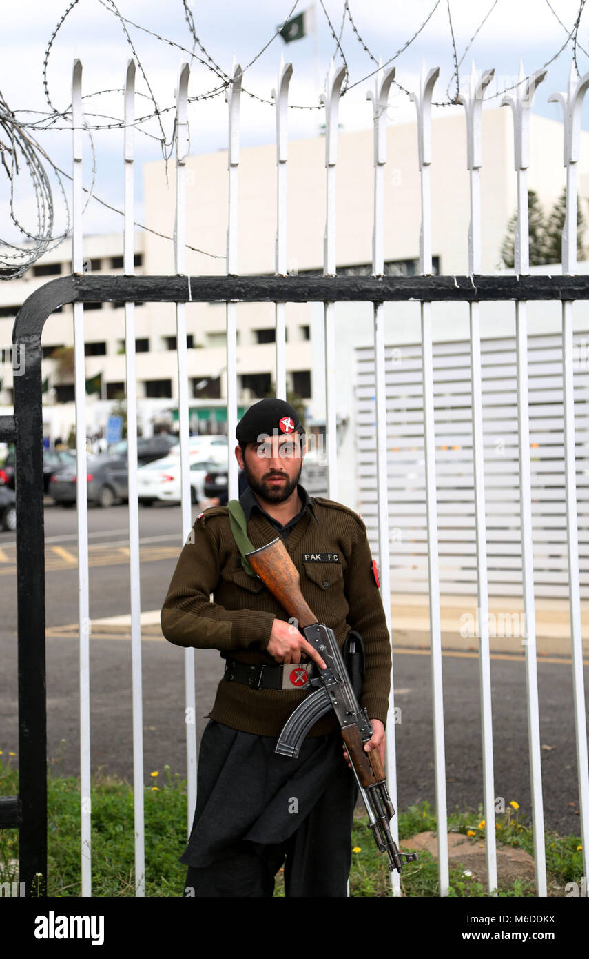 Islamabad. 3rd Mar, 2018. A Pakistani security official stands guard