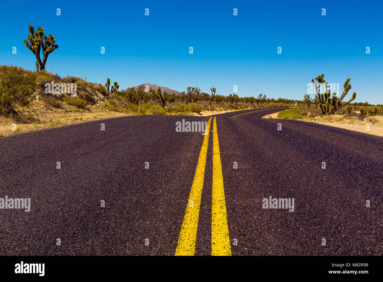 Famous Route 66 going through Mojave Desert in California Stock Photo