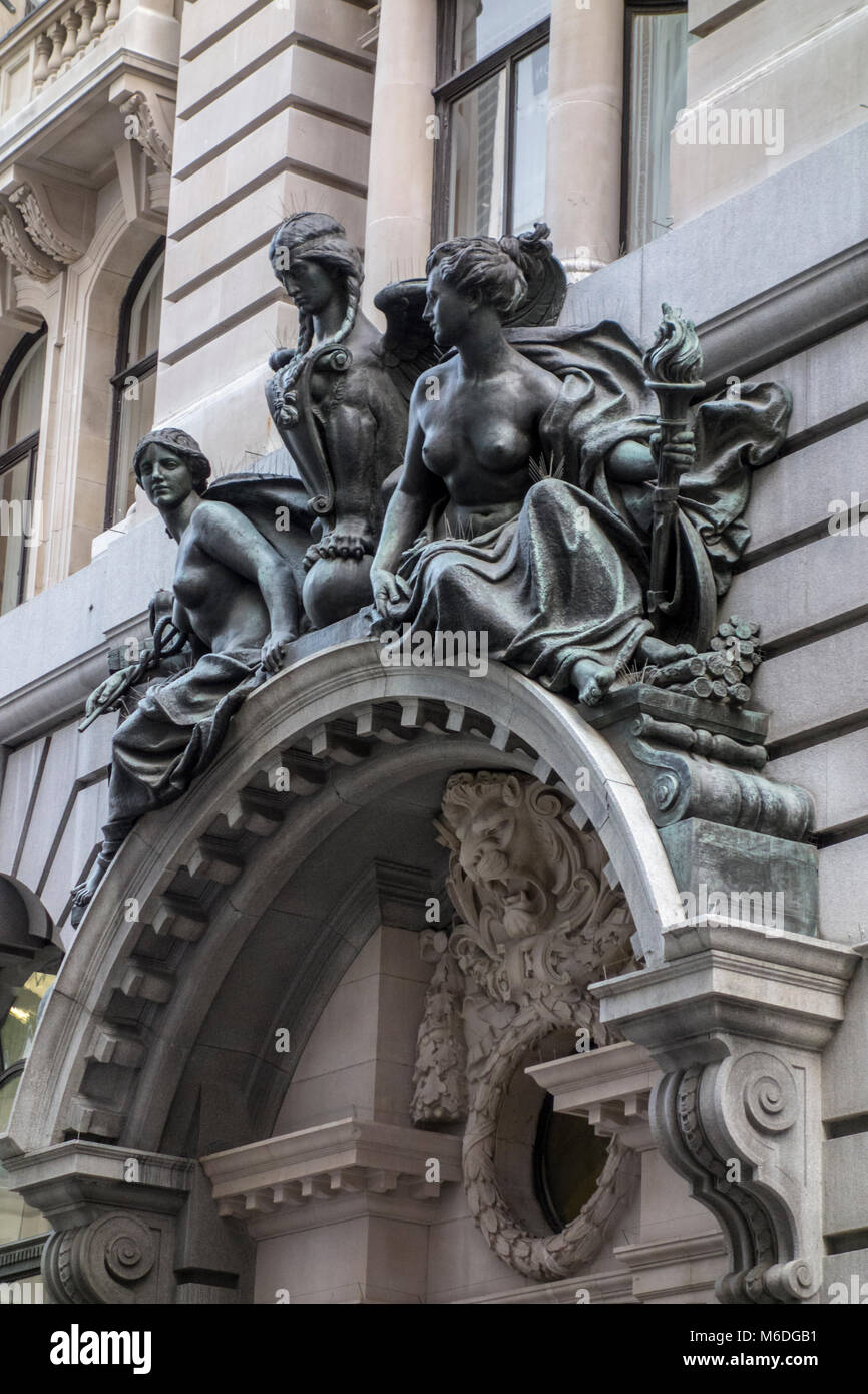 Bronze figures sculpture over entrance 24 - 28 Lombard Street, City of London, UK. 1910 Stock Photo