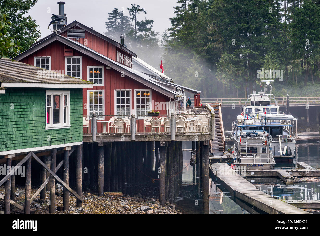Houses on stilts, boats at marina, Boardwalk Village at Telegraph Cove