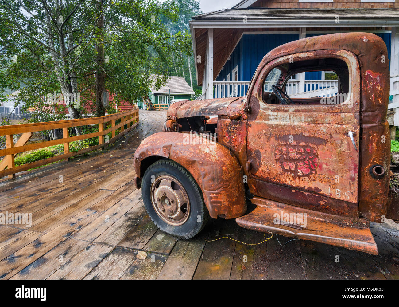 Old Rusted Truck Houses On Stilts After Rain Boardwalk