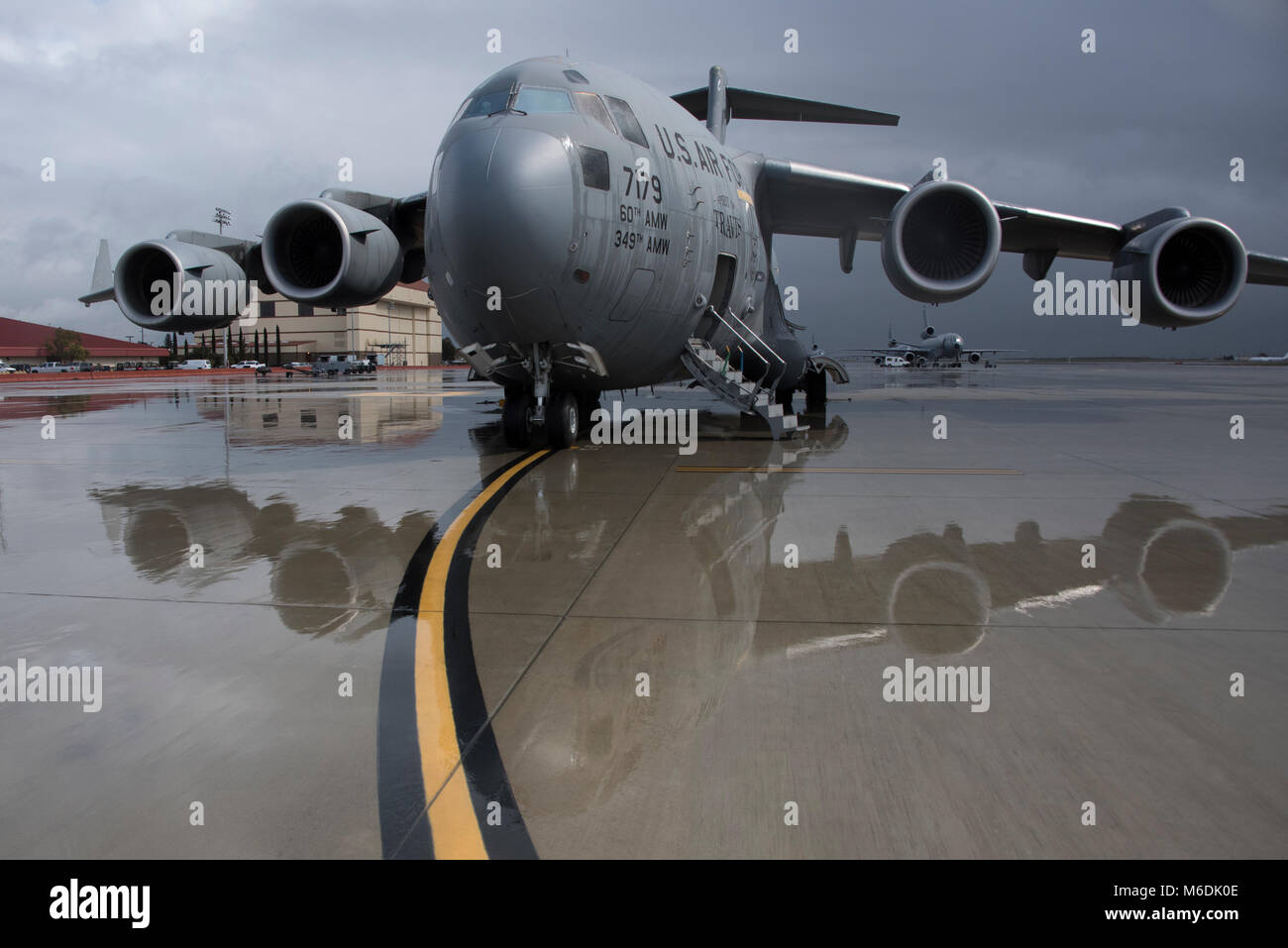 A C-17 Globemaster III parked on the ramp at Travis Air Force Base, Calif., March 1, 2018. The aircraft were part of a week-long base wide readiness exercise which evaluated the base’s readiness and ability to execute and sustain rapid global mobility around the world. (U.S. Air Force Photo by Heide Couch) Stock Photo