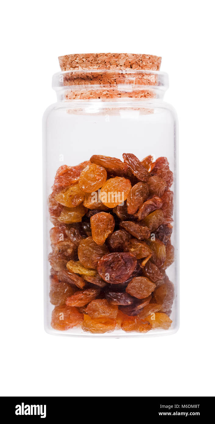 Raisins in a glass bottle with cork stopper, isolated on white. High ...