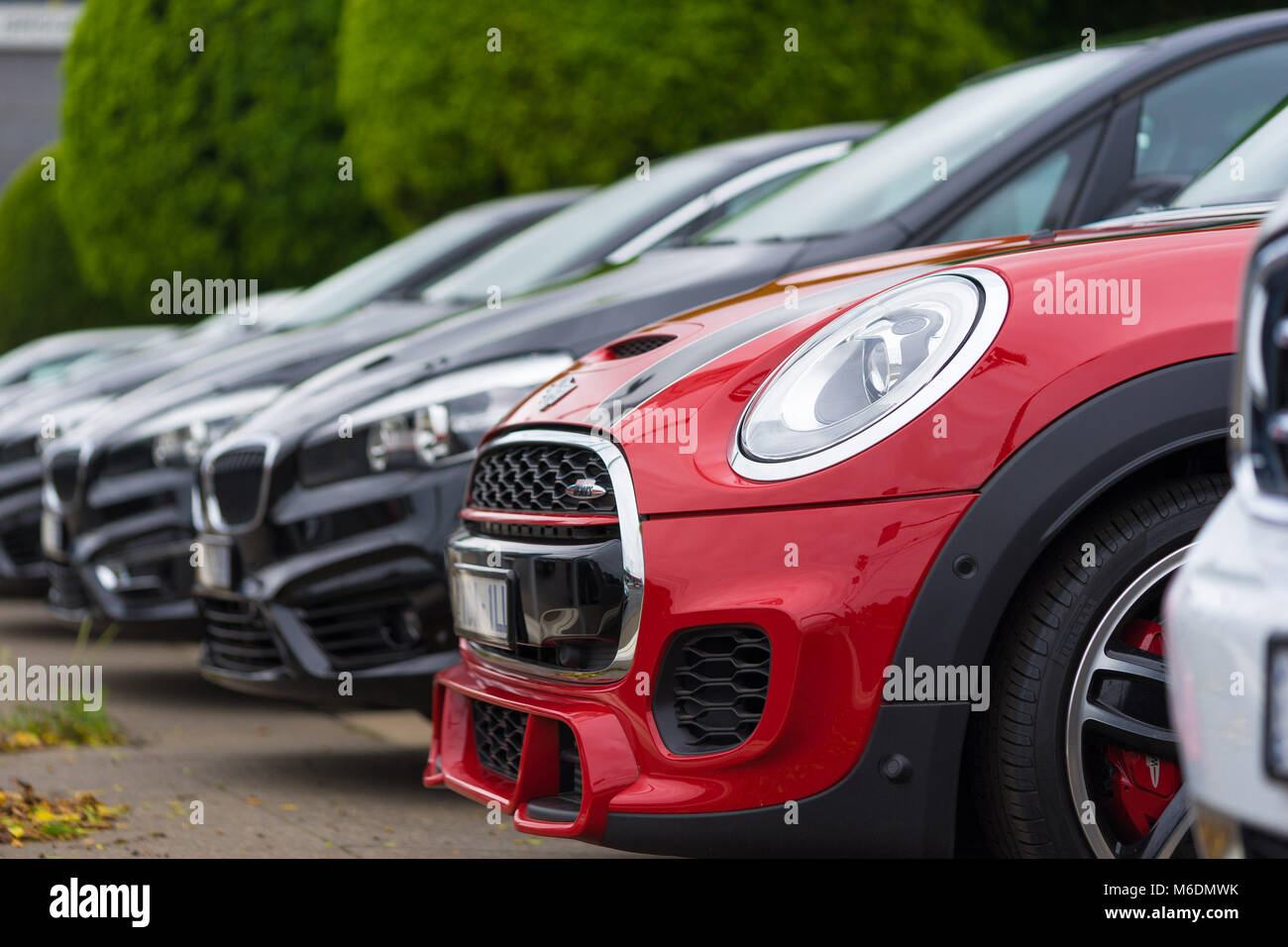 A lineup of brand new Mini and BMW cars at the dealership Stock Photo