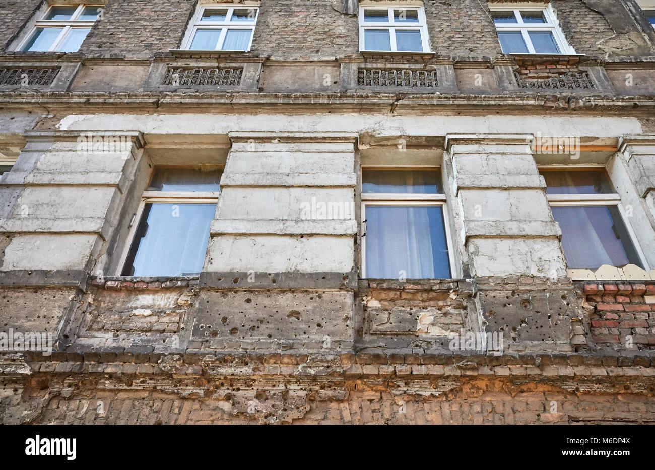 Bullet holes from the World War II in an apartment building in Niebuszewo district in Szczecin City, Poland. Stock Photo