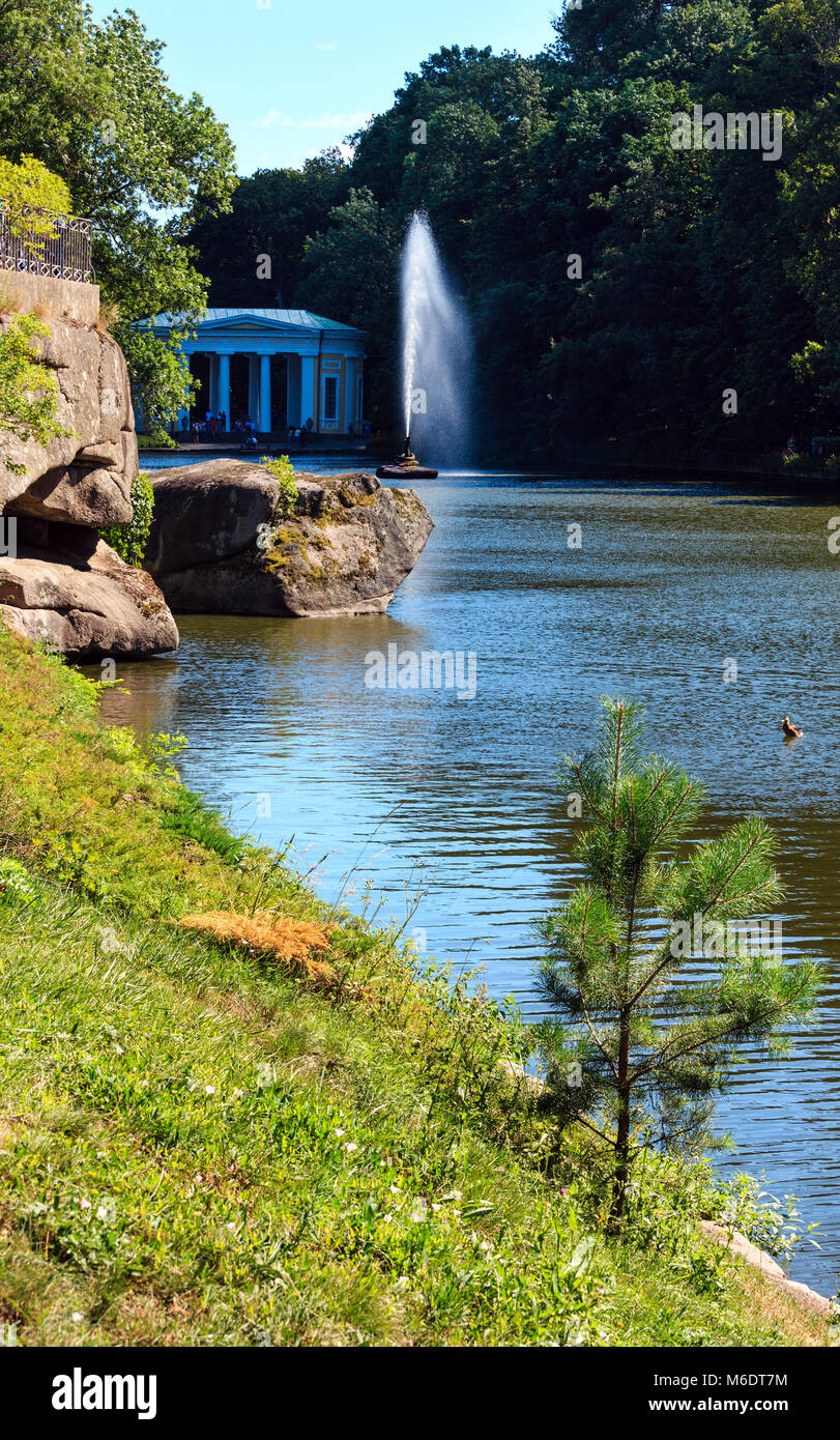 Summer National Dendrology Park of Sofiyivka, Fountain 'Snake' and lake. Uman, Ukraine. Build in 19th century. People unrecognizable. Stock Photo