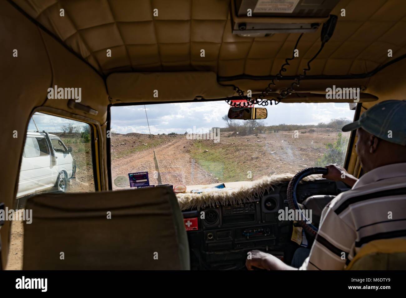 Masai Mara, Kenya - October 2017: Driving safari 4WD toyota terrrain jeep car on rocky african roads Stock Photo