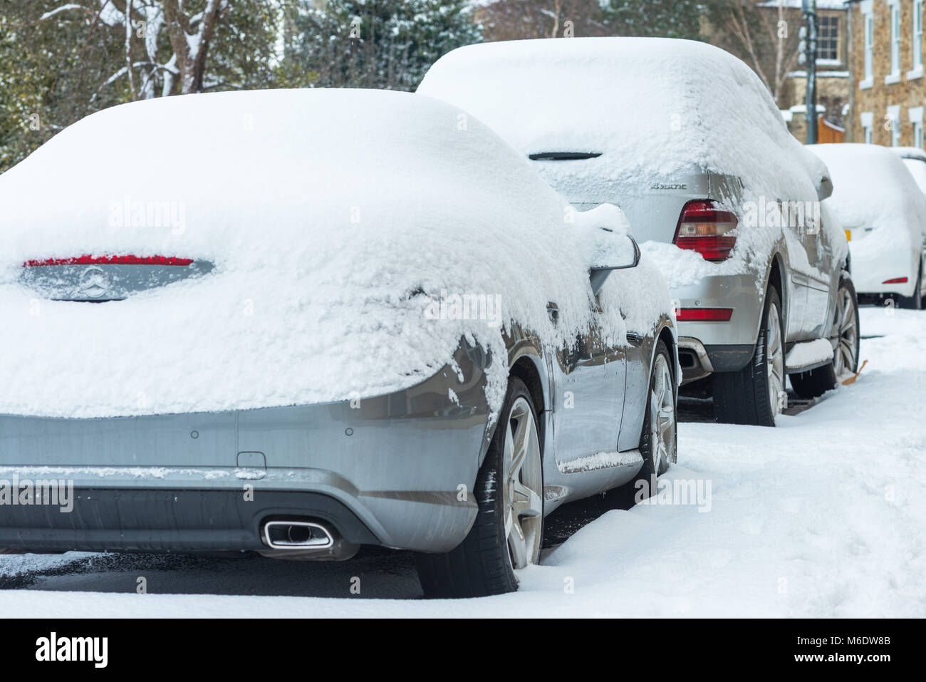 Cars covered with snow during winter Stock Photo