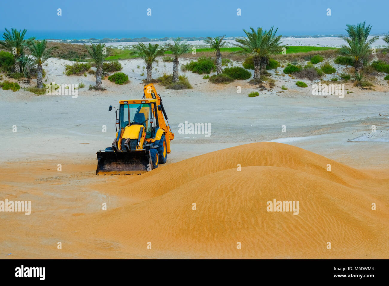 JCB Backhoe Construction Equipment abandoned in Desert area near Saadiyat Island Abu Dhabi Stock Photo