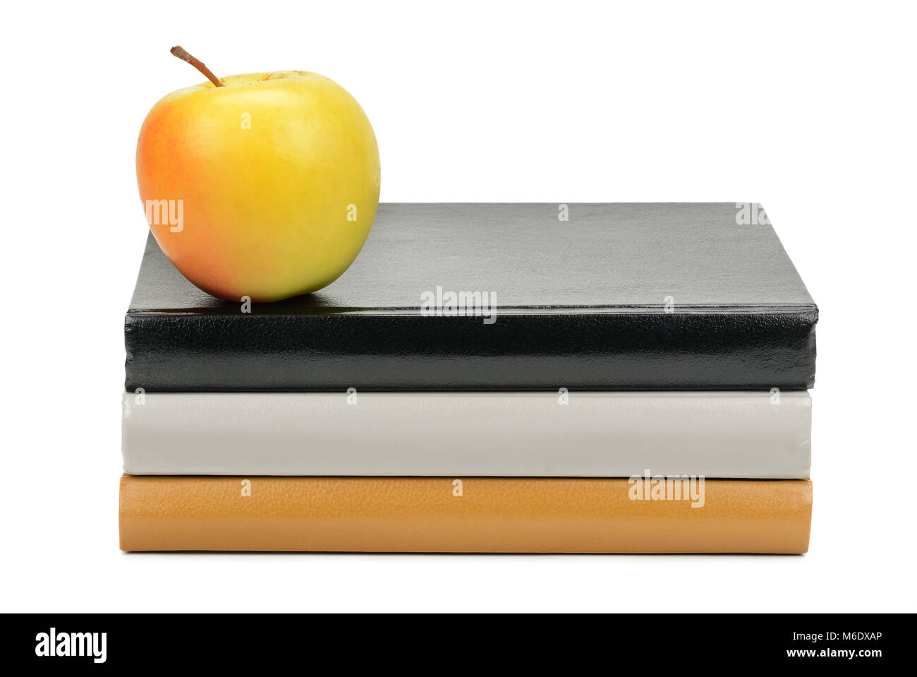 books and apple isolated on white background Stock Photo - Alamy