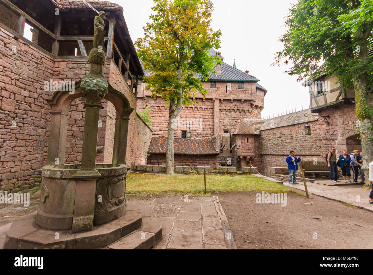 Well and inner courtyard of the Château du Haut-Konigsbourg, a medieval castle located Orschwiller, Bas-Rhin, Alsace, France, in the Vosges mountains  Stock Photo