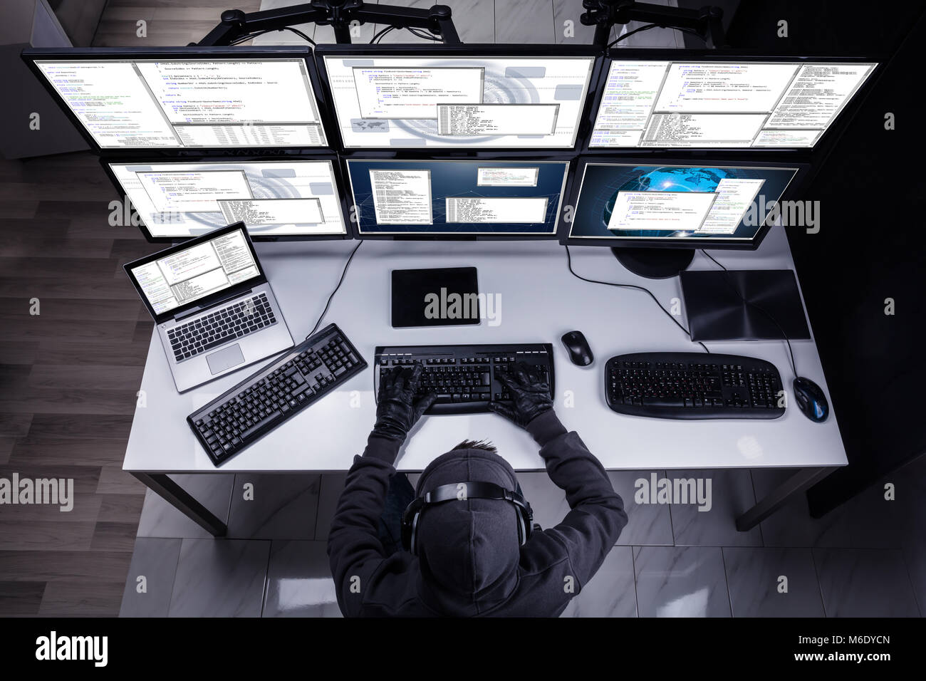 Man hacker in hood headphones hi-res stock photography and images - Alamy