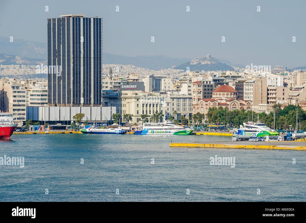 Port of Piraeus, Greece - Mai 30, 2017: View of the Piraeus Tower, the building of the Maritime Retirement Fund, the Holy Trinity Cathedral Stock Photo