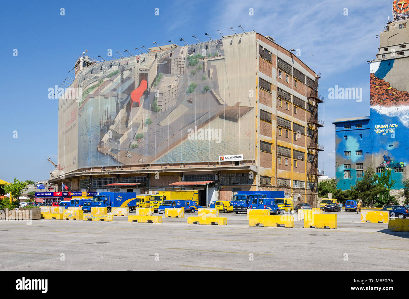 Port of Piraeus, Greece - Mai 30, 2017: Wall painting on one of the old  silo and dry docks  buildings in the industrial area of Silos Ietioneias Coas Stock Photo