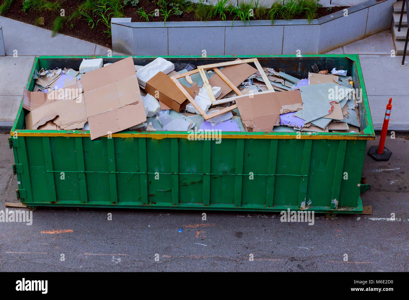 Construction waste in an metal container, home house renovation. container for construction