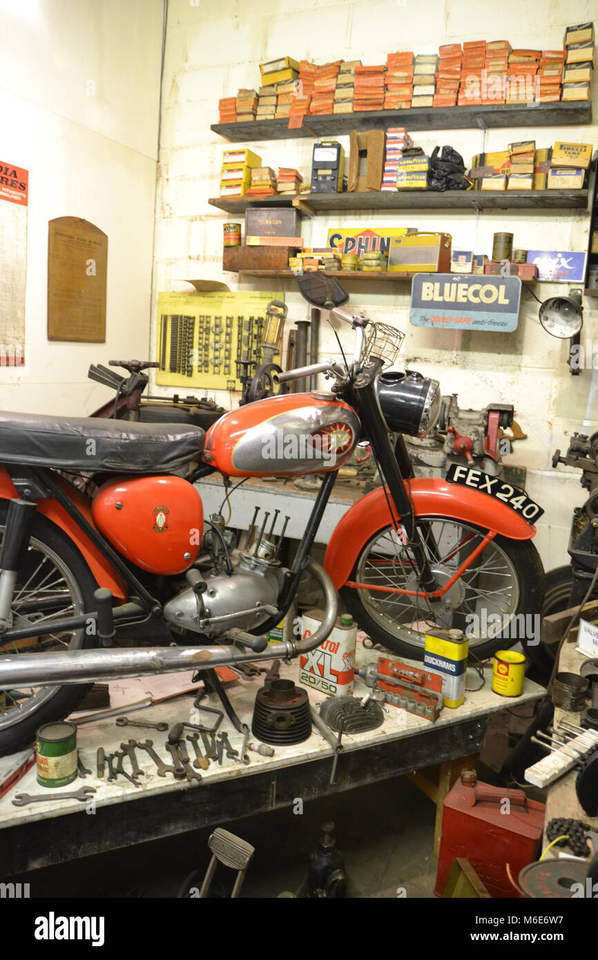 Motorcycle in repair workship at Ipswich Transport Museum, Suffolk